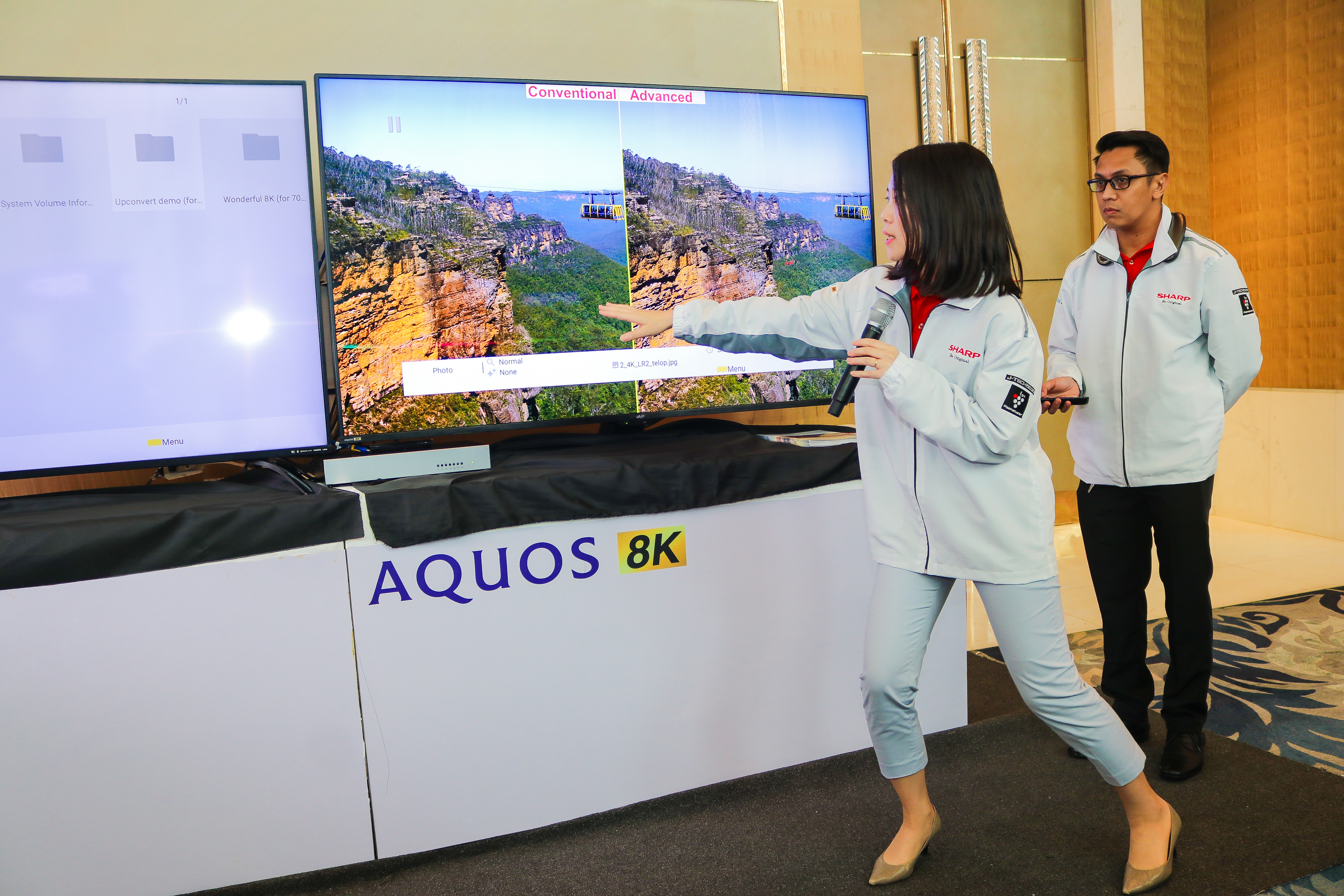 Supervisor of Asia Sales Promotion Division for Global TV Business Unit, Ms. Yukari Kawabata doing a AQUOS 8K TV demo.jpg